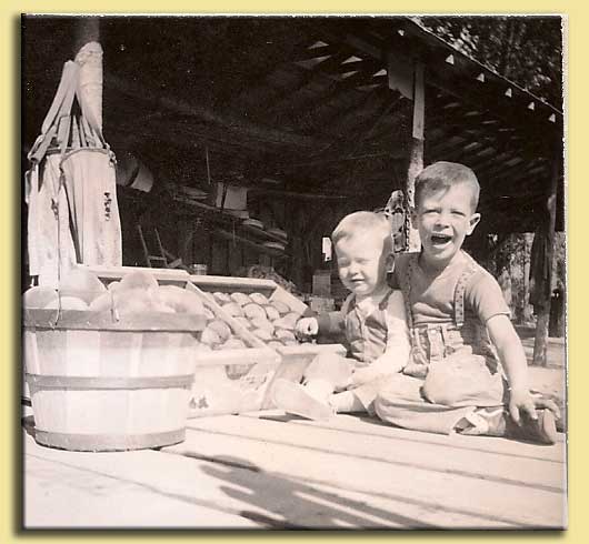 Young Roger and John with peaches